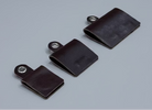 Three dark brown leather strap covers with metal snap loops, arranged diagonally on a light wood grain surface.